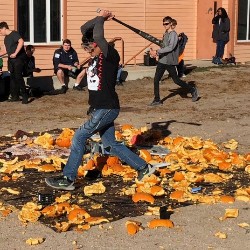 An AVC student smashes pumpkins in our annual Smash-a-thon event.